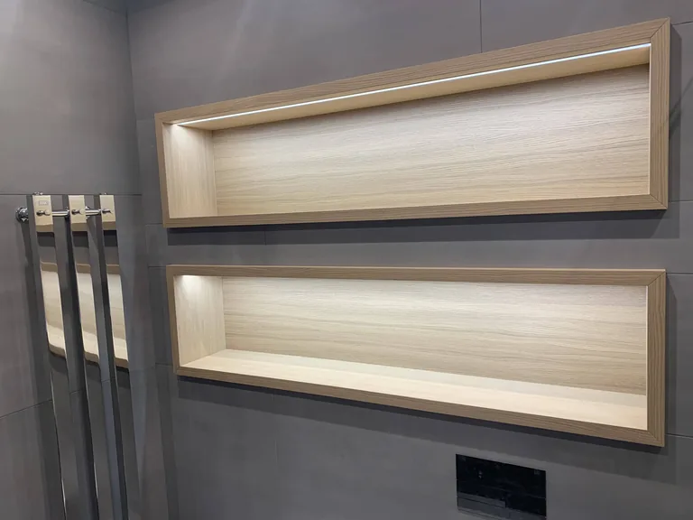 Turnkey custom furniture project in Illuminated Wall Niche Shelves Custom Furniture by RPGroup